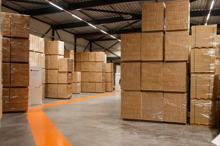Industrial warehouse with stacked packaging cartons